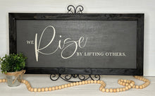 Load image into Gallery viewer, We Rise By Lifting Others - Rustic Framed Farmhouse Sign
